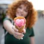 medium-shot-blurry-woman-with-ice-cream